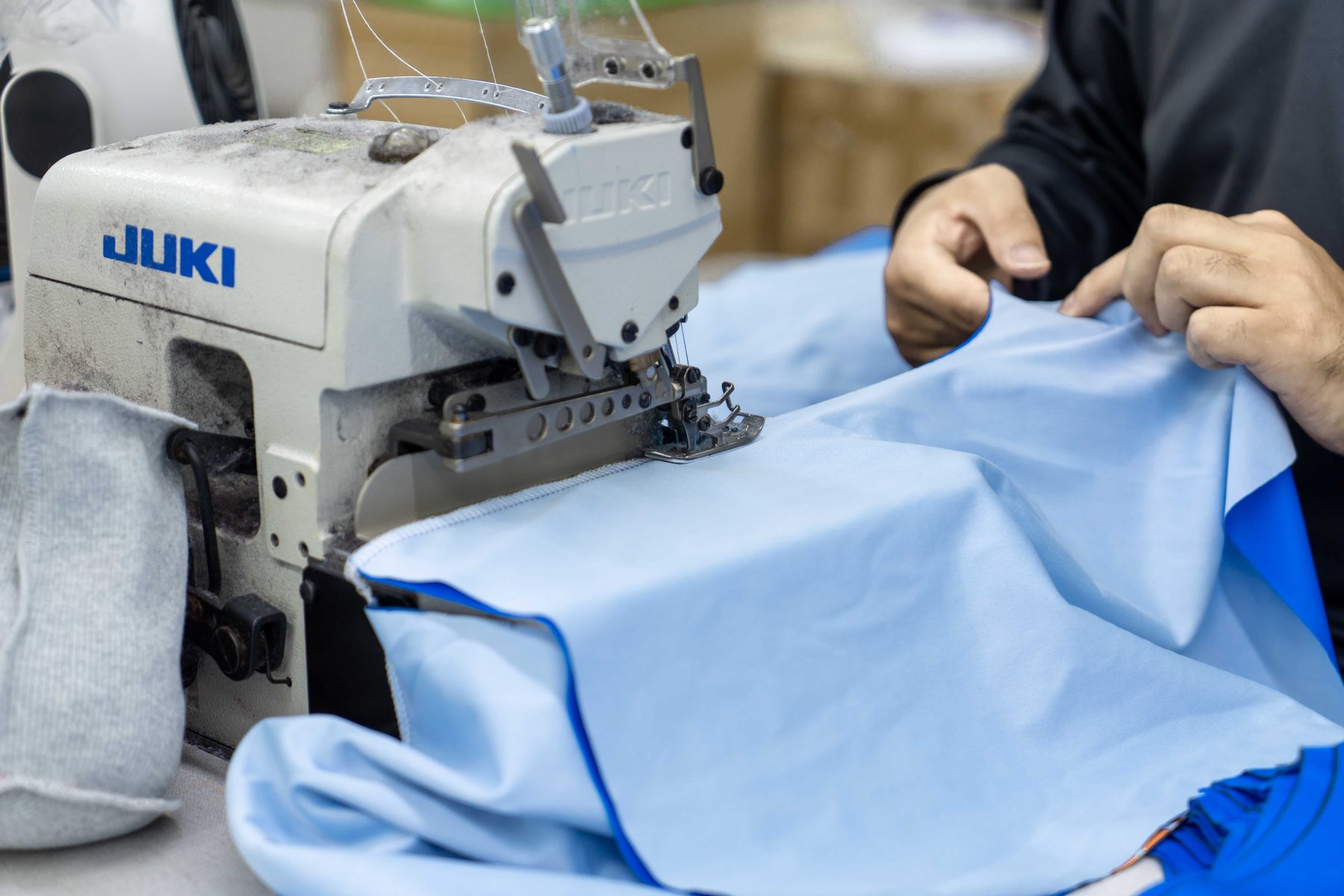 Sewing work on custom teamwear fabric